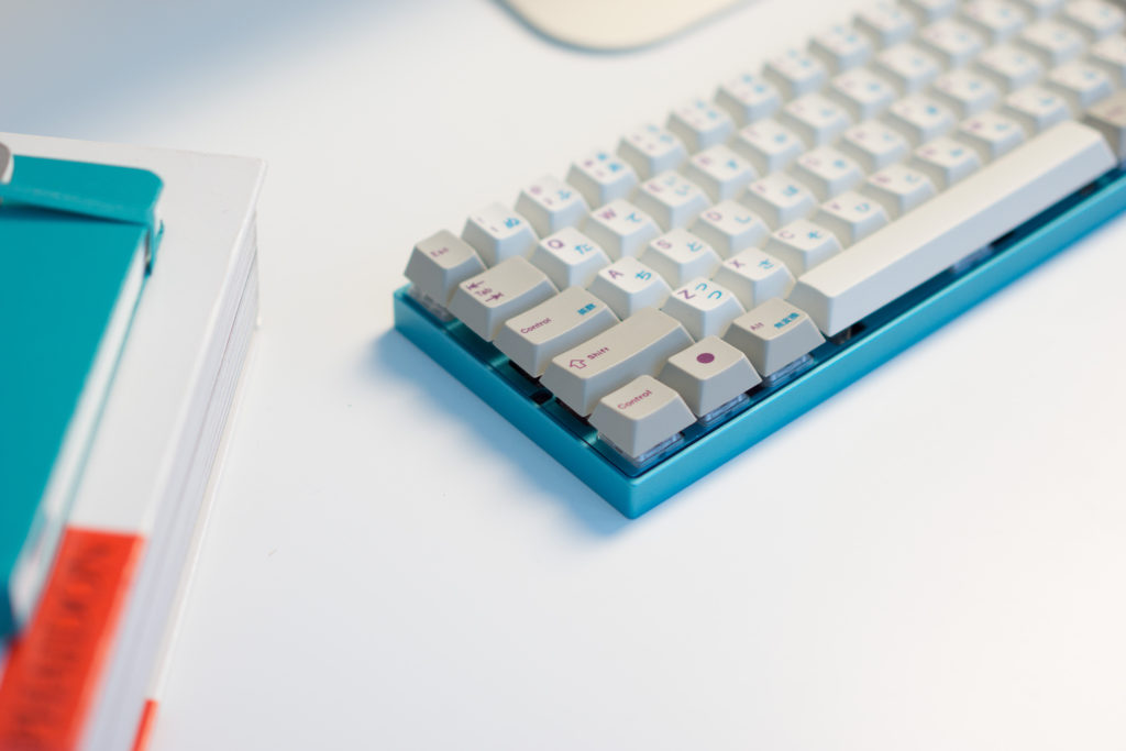 Custom keyboard with Zeal60, Zealiostotlespacers, Enjoy PBT Kana Keycaps, Sentraq Teal Plate and Case - Ryan MacLean