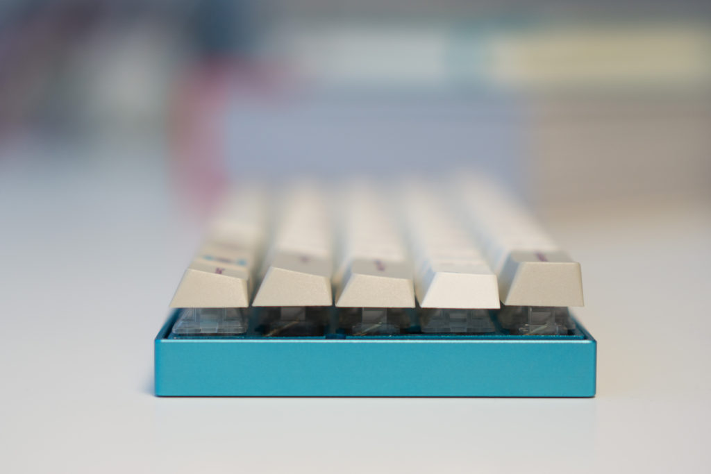 Custom keyboard with Zeal60, Zealiostotlespacers, Enjoy PBT Kana Keycaps, Sentraq Teal Plate and Case - Ryan MacLean